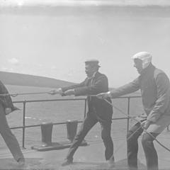 Group of Three Men on Shipboard