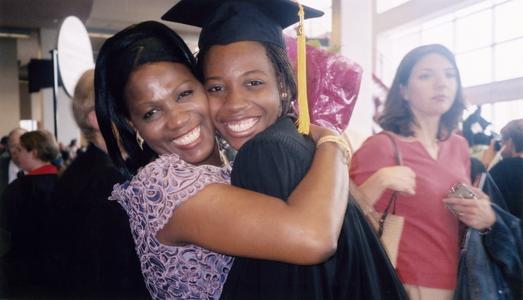 Nonso Njokanma hugs friend at 2003 graduation