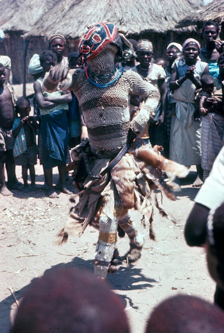 A Cokwe Maske Dancer Performing Circumcicion Ceremony Rites