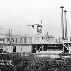Photograph of side view of the Kit Carson at shore