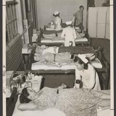 Nurses at a blood bank attend to their patients