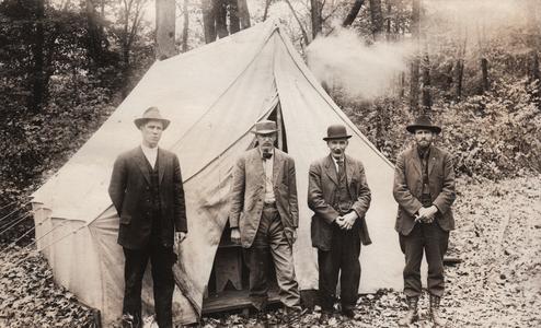 Group of miners by a tent