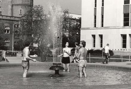 Students juggling in fountain on Library Mall