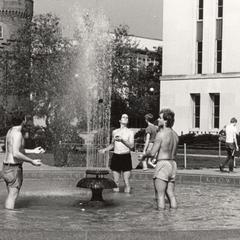 Students juggling in fountain on Library Mall