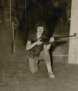 Girl holding a rifle at Racine Center