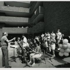 Stout Jazz Band performing outside for students in front of Heritage Hall, Spring 1990
