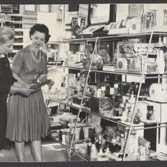 A shopper selects cosmetic products