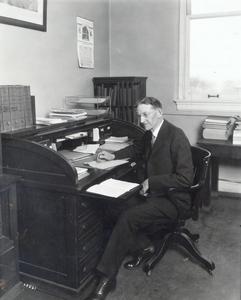 L.R. Jones at his Desk