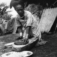 Woman Grinding Grain