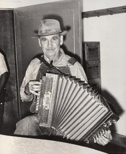 John “Happy” Routar plays accordion