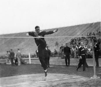 Charles McGinnis high jumping.