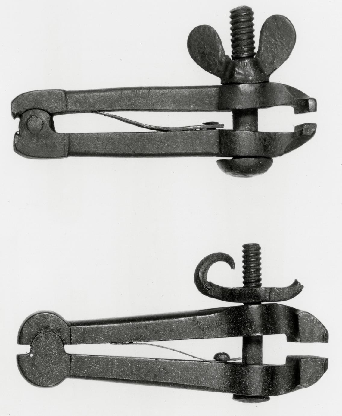 Black and white photograph of hand vises.