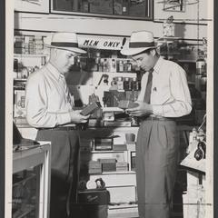 Two men shop in the mens department of a drugstore