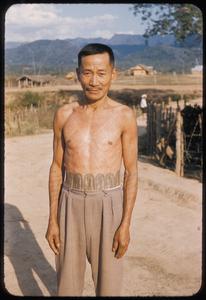 Lao man with tattoos in Muang Xay
