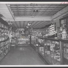Interior of drugstore looking to prescription department in the back