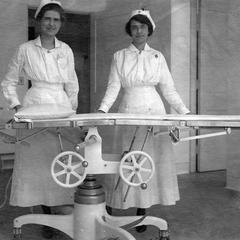 Nurses By Hospital Bed