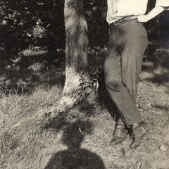 William J. Meuer leaning against tree
