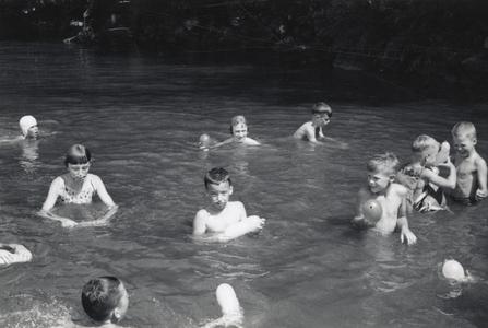 Children swim at Camp Gallistella Tent Colony