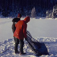 Inserting fish cage under ice