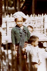 Young girl with her two young brothers in the Lu village of Ta Fa in Houa Khong Province