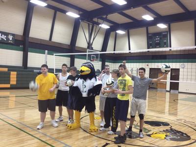 The Falcon mascot with students, UW Fond du Lac