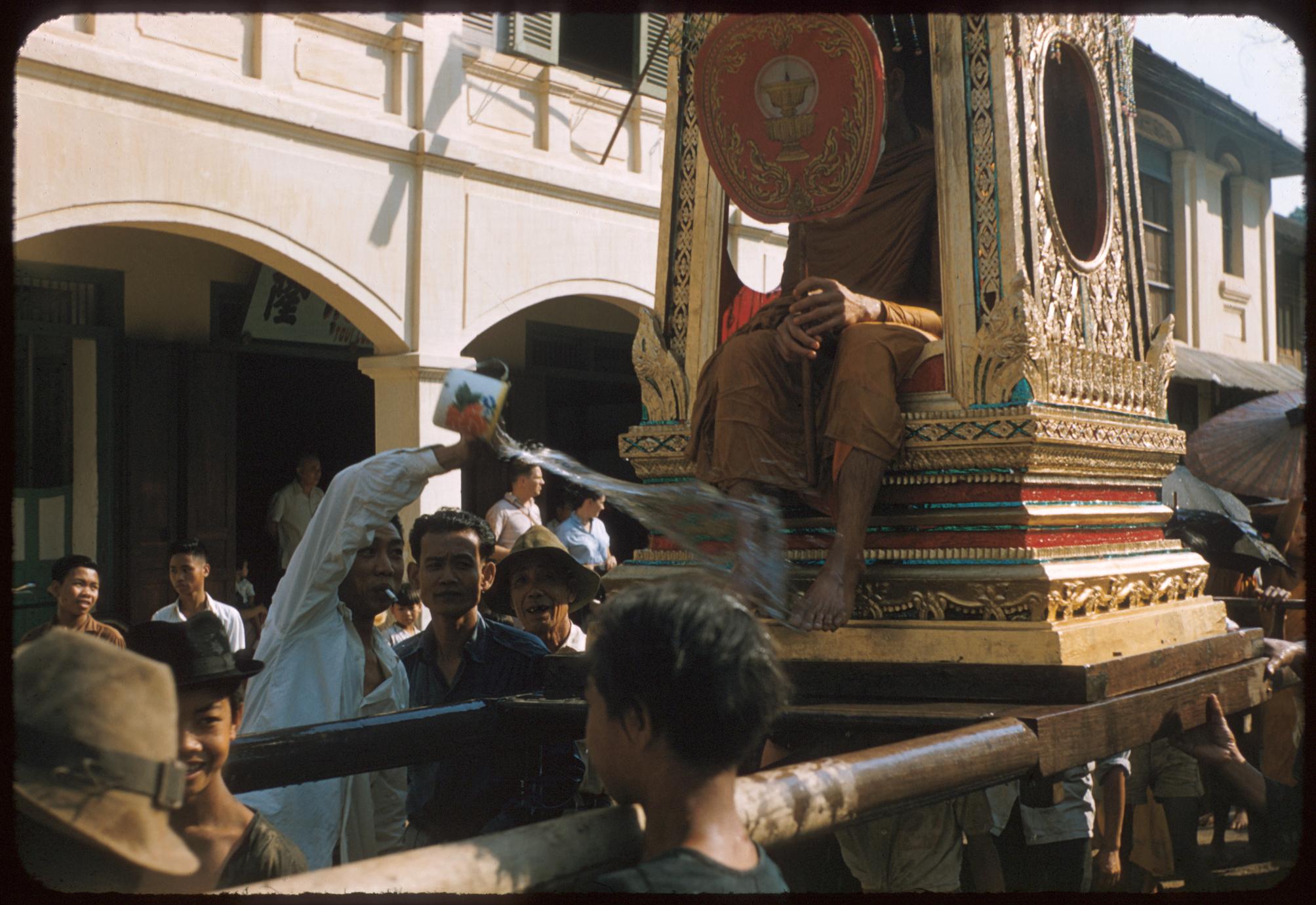 Carrying monk on palanquin