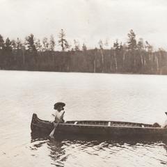 American Indians in canoe