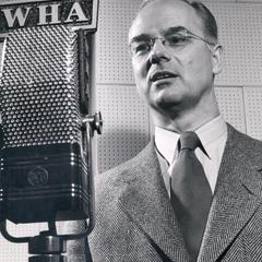H.B. McCarty at a microphone