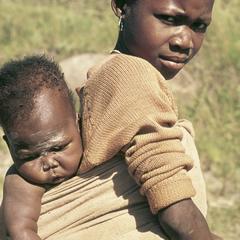 People of South Africa : Xhosa girl carrying a child