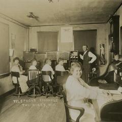 Telephone Exchange workers and a supervisor in about 1917