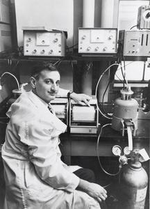 Charles Heidelberger with lab equipment