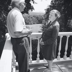 Edwin Young and Phyllis Smart Young stand on a deck