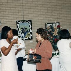 Two women talk at 1995 graduation reception