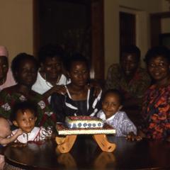 Group presenting Trager's birthday cake