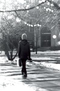 Student walking in winter on campus
