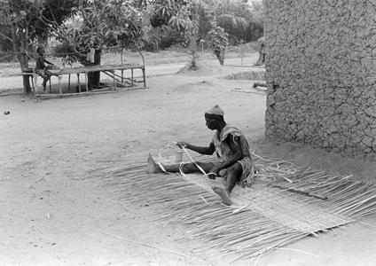 Man Weaving a Mat