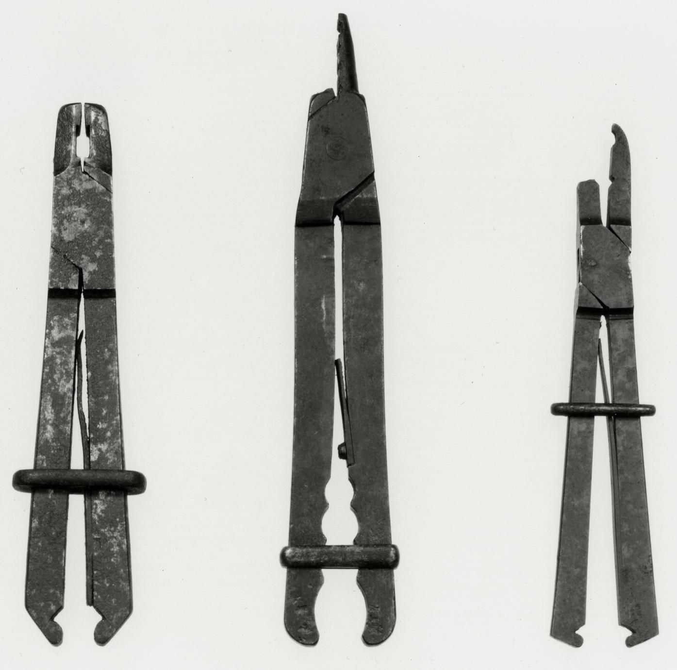 Black and white photograph of sliding or buckle tongs.