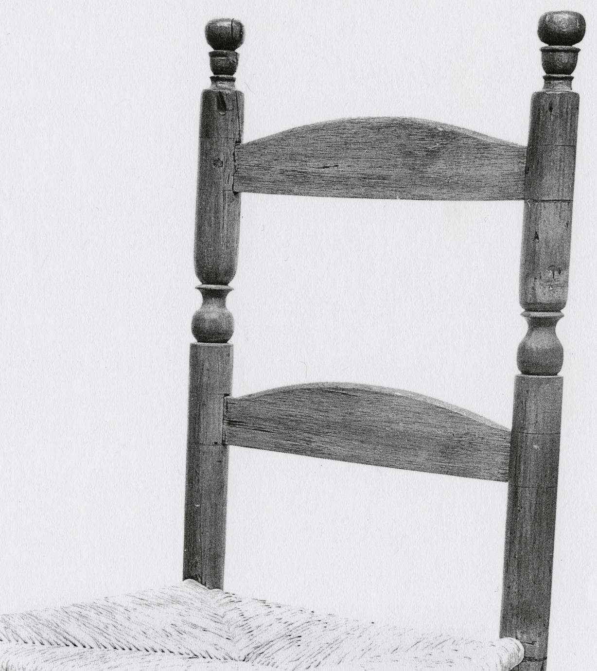 Black and white photograph of a slat-back chair back.