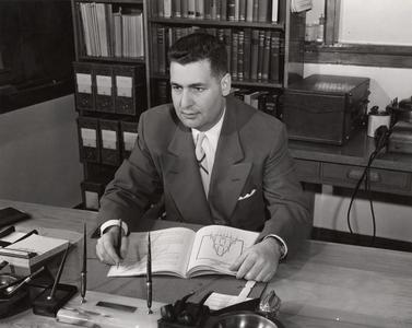 William S. Apple at his desk