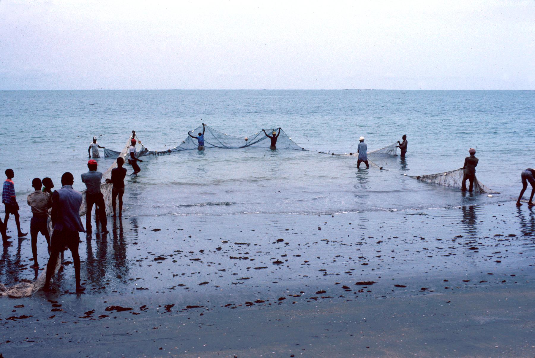 Fisherman Casting Net on the Ubangi River - UWDC - UW-Madison