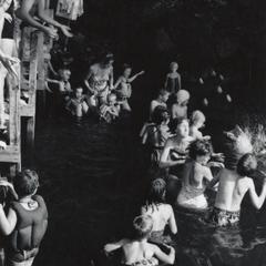Swimmers and spectators at Camp Gallistella Tent Colony