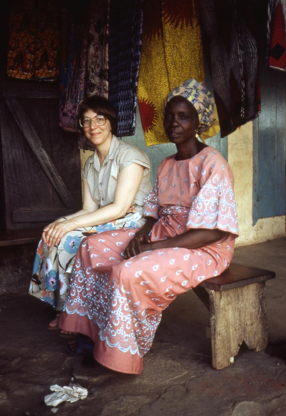 Trager and Mrs. Ajayi on a bench