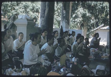 2500th Anniversary of Buddhism- women praying outside Vat Mai