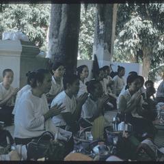 2500th Anniversary of Buddhism- women praying outside Vat Mai