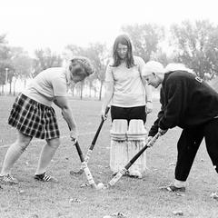 Three female field hockey players