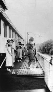 Women playing shuffleboard on deck of the Gordon C. Greene
