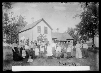 Family in front of rural house