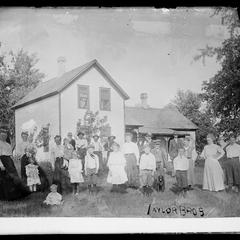 Family in front of rural house