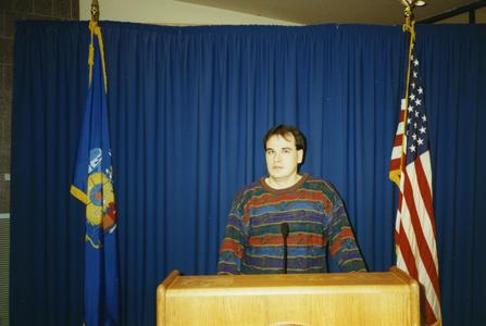 Stout Student Association, Chris Fellom standing at podium