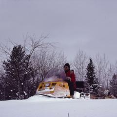 Bill Tonn on a snowmobile